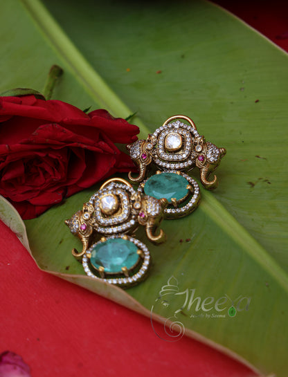 Close-up detailing of Rajkumari Mini Mint Elephant Studs highlighting Moissanite craftsmanship.
