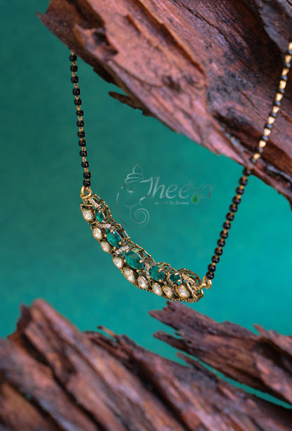 Green and moissanite Pendant with black beads