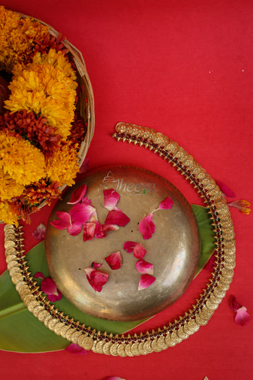 Close-up detailing of Mahalakshmi Haram Kaasu Mala highlighting Antique Gold craftsmanship.
