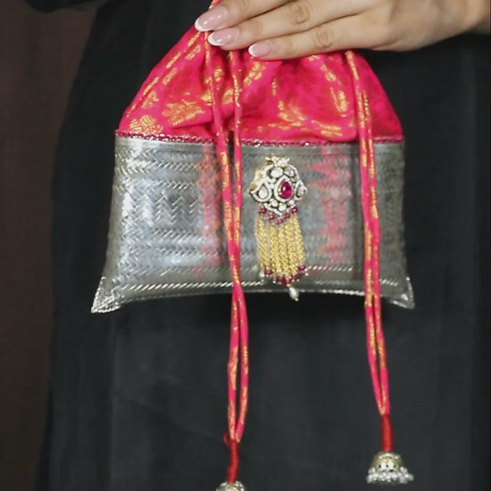 Luxurious pure silver evening potli bag embellished with pink moissanite stones