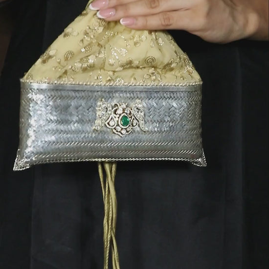 Premium silver potli evening bag studded with radiant golden moissanite