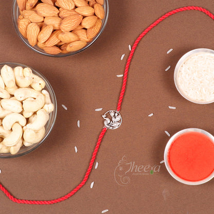 Pure Silver Rakhi tied on a wrist for Raksha Bandhan