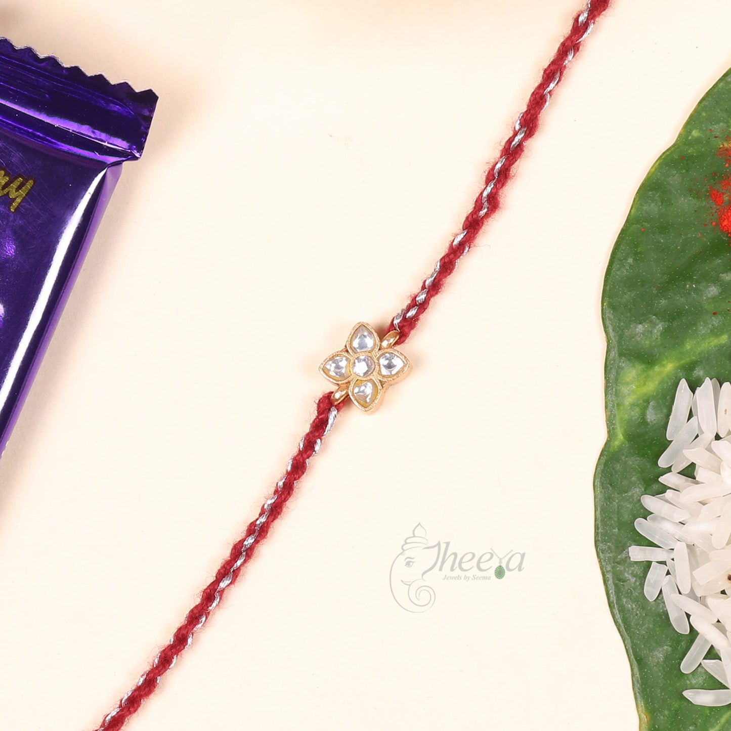 Silver White Four Petal Flower Rakhi