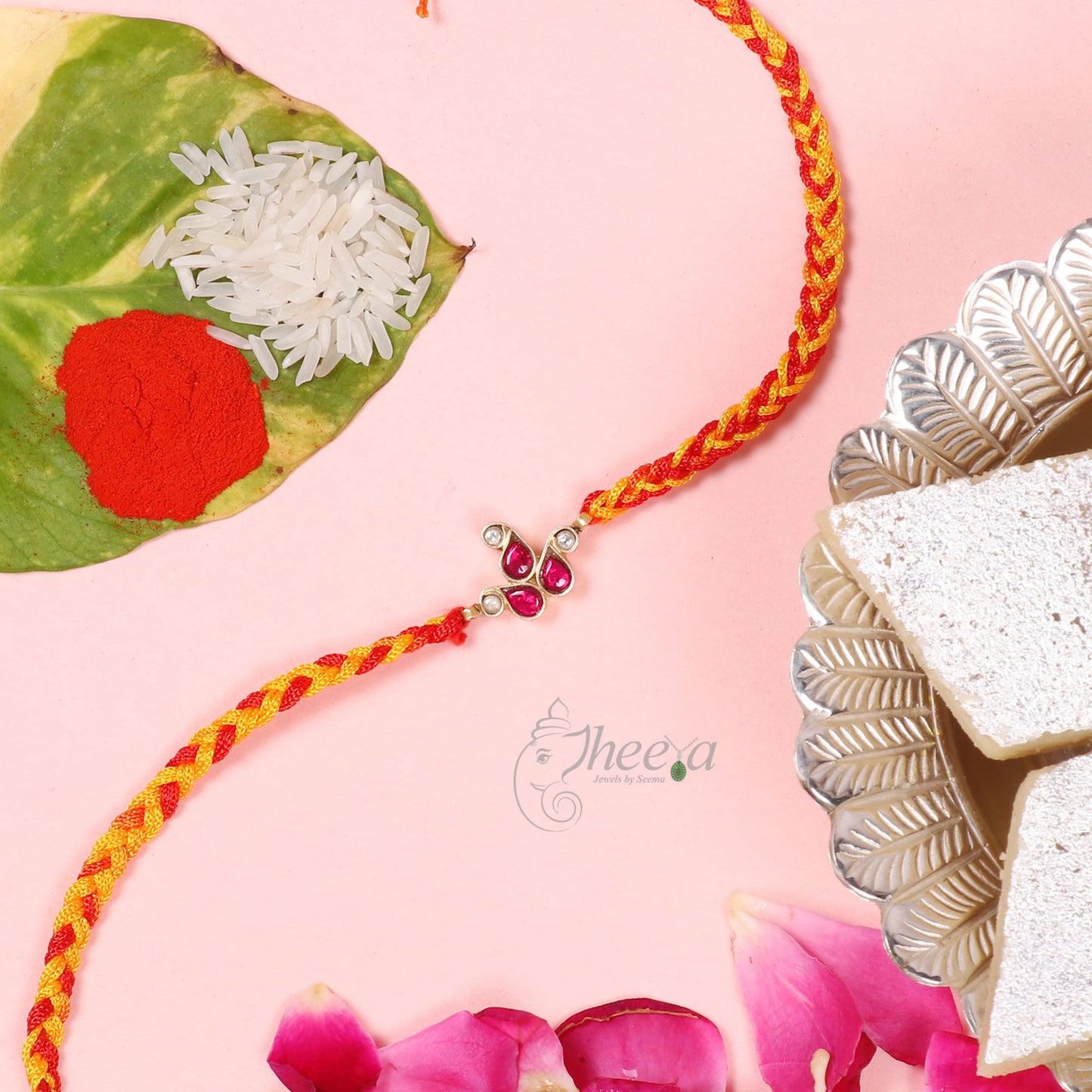 Close up of Pure Silver Red and White Paisley Rakhi by Sakshi