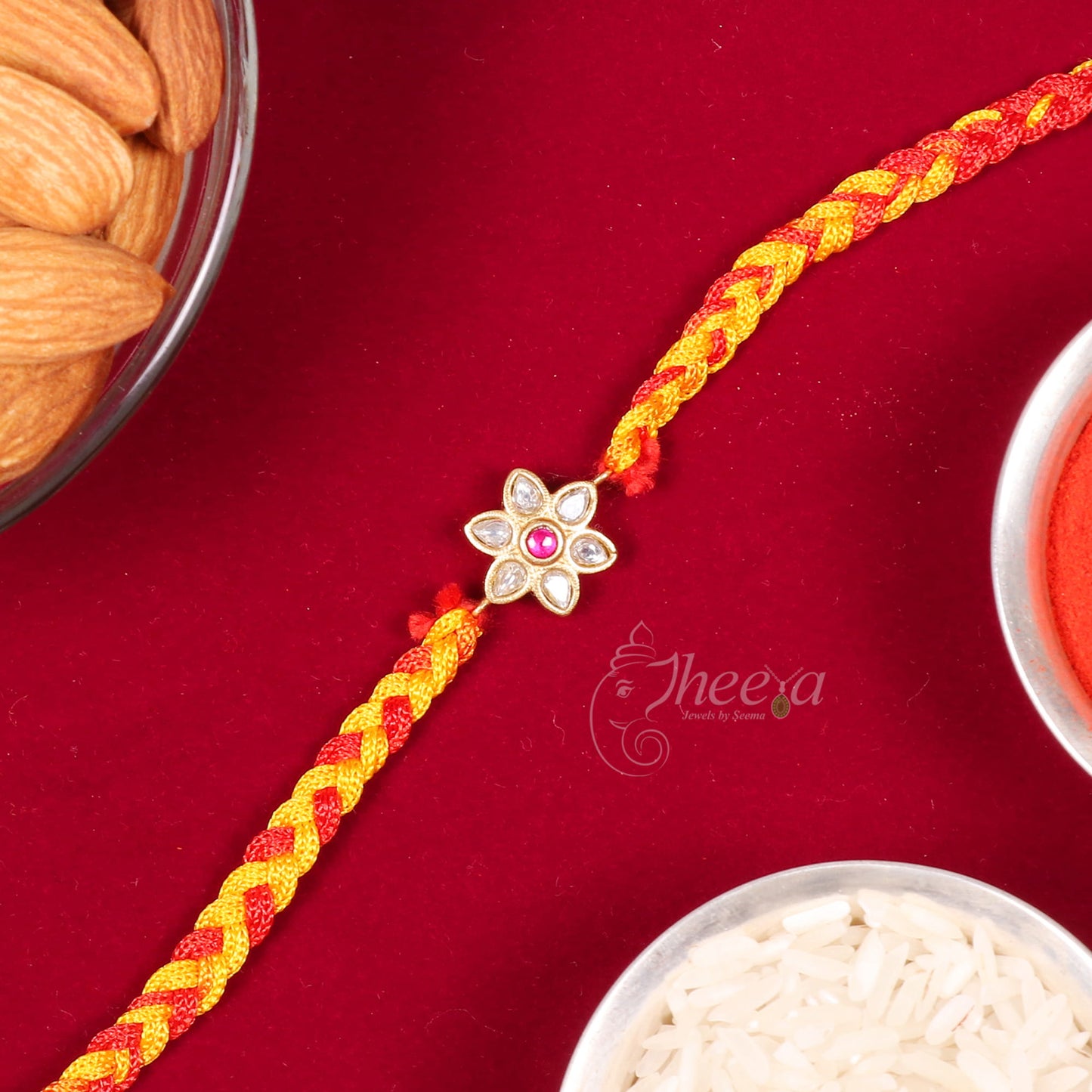 Delicate white floral and red stone traditional silver sibling thread